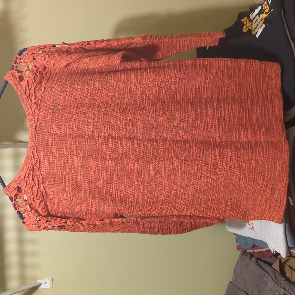 Women's reddish orange top